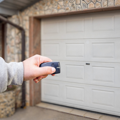 Ocala security key fob pointing to a garage door